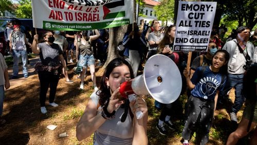 Pro-Palestinian protesters chant at police at the Emory campus in Atlanta following arrests on Thursday, April 25, 2024. (Arvin Temkar / AJC)