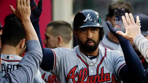 Atlanta Braves' Matt Kemp celebrates in the dugout after a home run against the Los Angeles Angels during the second inning of a baseball game in Anaheim, Calif., Wednesday, May 31, 2017. (AP Photo/Chris Carlson)