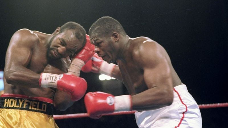 Boxers Riddick Bowe and Evander Holyfield trade blows during their Nov. 6, 1983, bout in Las Vegas.