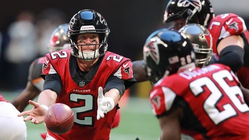 Atlanta Falcons quarterback Matt Ryan pitches to running back Tevin Coleman during the second half against Sunday, Oct 14, 2018, against the Tampa Bay Buccaneers at Mercedes-Benz Stadium in Atlanta.