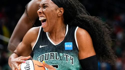 FILE - New York Liberty forward Kayla Thornton, bottom, reacts in front of Seattle Storm center Ezi Magbegor, top, as a jump ball is called during the first half of a WNBA basketball game May 30, 2023, in Seattle. Two WNBA players were among a dozen Americans that opted to play in Russia this past offseason, a decision Thornton said raised a few eyebrows following Brittney Griner’s incarceration in 2022. (AP Photo/Lindsey Wasson, File)