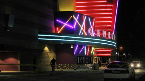 In a July 20, 2012, file photo, police stand outside the Century 16 movie theater in Aurora, Colorado. Gunman James Holmes walked into a midnight screening of "The Dark Knight Rises" and opened fire, killing 12 people and injuring another 70.