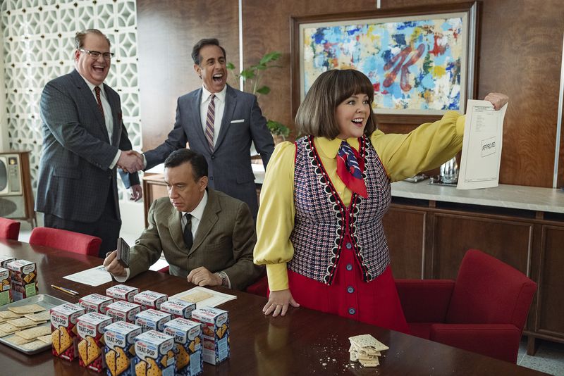 This image released by Netflix shows Jim Gaffigan, from left, Jerry Seinfeld, Fred Armisen, seated, and Melissa McCarthy in a scene from "Unfrosted." (John P. Johnson/Netflix via AP)