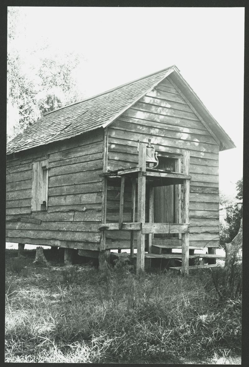 A Black praise house on Sapelo Island in McIntosh County, Georgia. It is a rustic cabin-type structure used as a church with a bell in front, that goes back centuries. Courtesy of Muriel and Malcolm Bell, Library of Congress/Provided by PBS