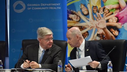 Roger Folsom (left), vice chairman, and Frank W. Berry, commissioner of the Georgia Department of Community Health (DCH), confer during a Georgia Department of Community Health board meeting in Atlanta in August.  At that point Georgia had failed to perform targeted infection control inspections of hospitals that were requested by the federal government as a result of the pandemic.  (PHOTO by Hyosub Shin / Hyosub.Shin@ajc.com)