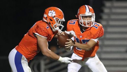 Parkview quarterback Jordan Williams (7) hands off to running back Cody Brown (7) during a 2018 victory over Norcross. They are two of eight all-region players that Parkview will return in 2019.