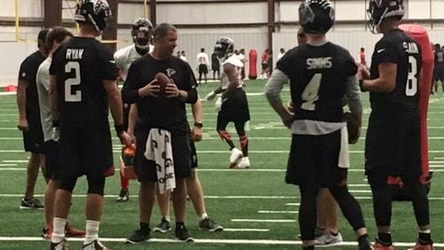 Falcons quarterback Matt Ryan receiving some instruction at practice on Tuesday. (By D. Orlando Ledbetter)