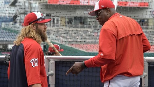 Manager Dusty Baker (right) of the Washington Nationals talks with Jayson Werth during batting practice before the game against the Miami Marlins at Nationals Park on April 5, 2017 in Washington. (Photo by Greg Fiume/Getty Images)