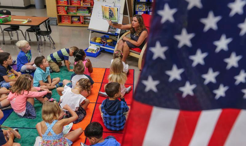 Kristin Shidneck reads out loud to her kindergarteners at Mountain View Elementary School one the first day of school, July 31, 2017 .  JOHN SPINK/JSPINK@AJC.COM.