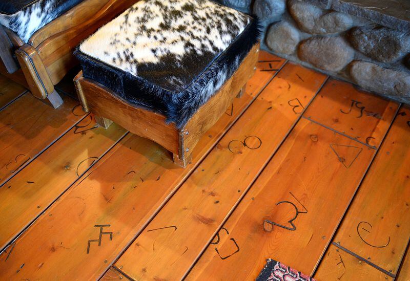 The wood floor in the great room at Karen Perez's home features burnt-in brands that she did with some help with friends, as seen on Wednesday, Sept. 27, 2017. (Craig Kohlruss/Fresno Bee/TNS)