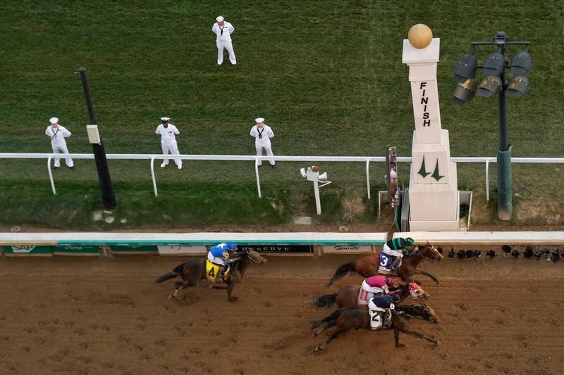 Brian Hernandez Jr. rides Mystik Dan, top right, to the finish line to win the 150th running of the Kentucky Derby horse race at Churchill Downs Saturday, May 4, 2024, in Louisville, Ky. (AP Photo/Charlie Riedel)