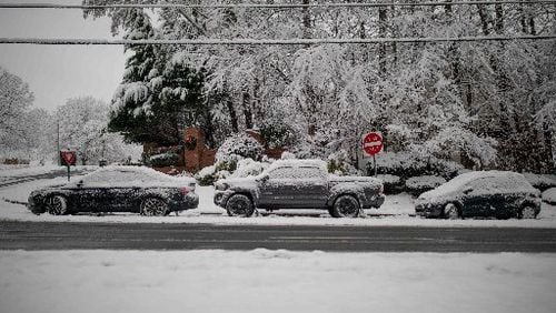 Vehicles sit abandoned on Bells Ferry Road in Acworth after a snowstorm hit Atlanta and North Georgia.
