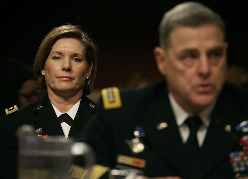U.S. Army Gen. Laura Richardson sits behind U.S. Army Chief of Staff Mark Milley while he testifies about women in the military during a Senate Armed Services Committee hearing on Capitol Hill.