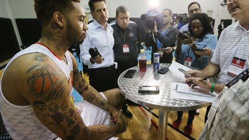 Hawks forward MIke Scott, who was arrested on felony drug charges earlier this year, is surrounded by news media with questions during the team's annual Media Day at the Philips Arena Practice Court on Monday, Sept. 28, 2015, in Atlanta.