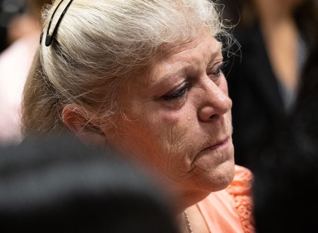 210727-Canton-A tear rolls down the cheek of a woman sitting with the friends and family of victims during the plea hearing for spa shooting suspect Robert Aaron Long in Superior Court of Cherokee County in Canton on Tuesday morning, July 27, 2021. Ben Gray for the Atlanta Journal-Constitution