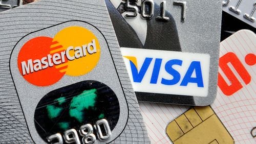 Credit card debt is at a nearly five-year high as consumers feel more comfortable relying on credit and are taking out new cards, according to data from credit reporting agencies.