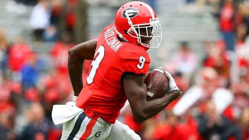 Georgia wide receiver Jeremiah Holloman (9) scores a touchdown during G-Day Saturday, April 20, 2019, at Sanford Stadium in Athens,.