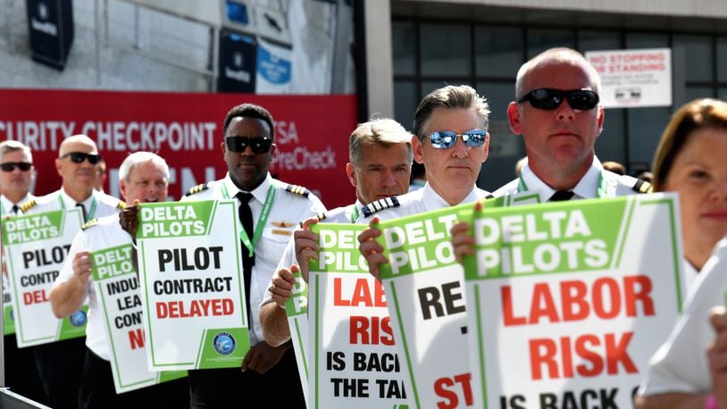 September 1, 2022 Atlanta - Delta pilots conduct informational picketing at the south terminal at Hartsfield-Jackson Atlanta International Airport ahead of the busy Labor Day travel weekend as they push for a new labor contract on Thursday, September 1, 2022. (Hyosub Shin / Hyosub.Shin@ajc.com)