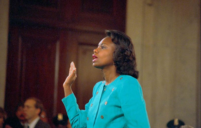 (Original Caption) Washington: Professor Anita Hill is sworn-in before testifying at the Senate Judiciary hearing on the Clarence Thomas Supreme Court nomination. Miss Hill testified on her charges of alleged sexual harassment by Judge Thomas.