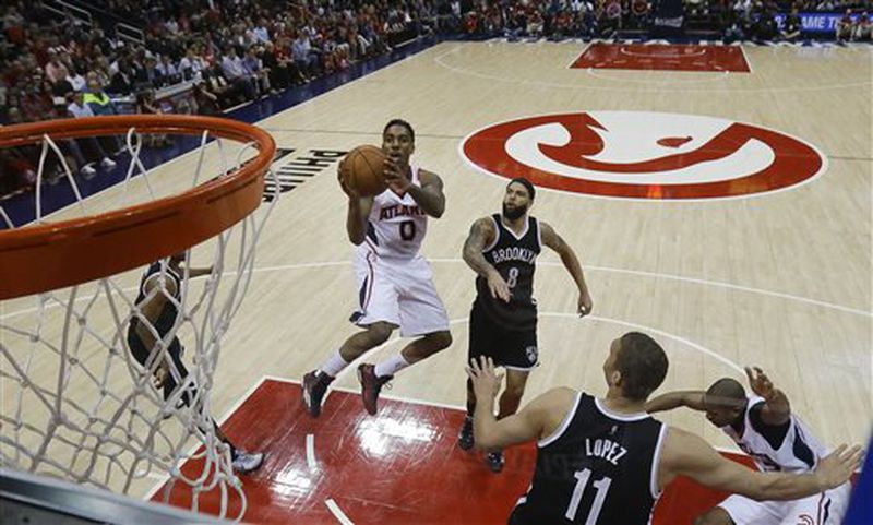 Atlanta Hawks guard Jeff Teague (0) goes to the basket as Brooklyn Nets guard Deron Williams (8) defends in the first half of an NBA playoff basketball game Sunday, April 19, 2015, in Atlanta. (AP Photo/John Bazemore) Jeff Teague goes to hoop. Never a bad plan. (AP Photo/John Bazemore)