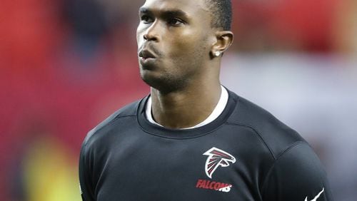 Injured Falcons wide receiver Julio Jones watches his teammates warmup for an NFL football game against the 49ers on Sunday, Dec. 18, 2016, in Atlanta. Curtis Compton/ccompton@ajc.com