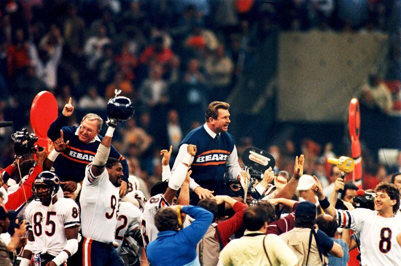 Bears coach Mike Ditka and defensive coordinator Buddy Ryan are carried around the field after they defeated New England 46-10 to win Super Bowl XX in New Orleans.