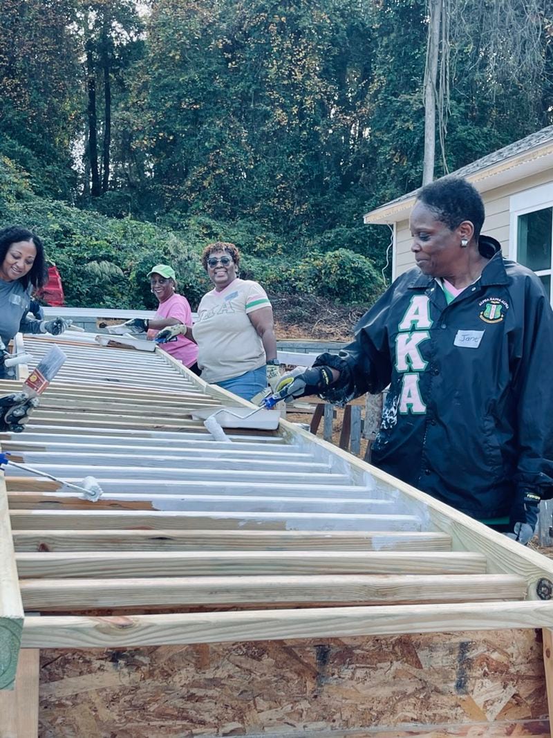 Jane Mosley, a member of the Pi Alpha Omega chapter of Alpha Kappa Alpha Sorority, puts in sweat equity at Tekia Rice's new home. Photo is courtesy of Pi Alpha Omega.
