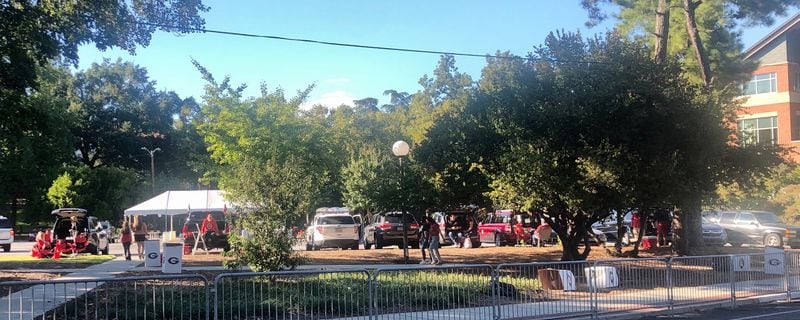 There was an occasional tent to be found in UGA parking lots as Georgia fans tailgated before the Auburn game Saturday night in Athens. (Chip Towers/Chip.Towers@ajc.com)