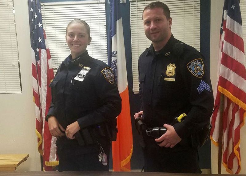Rookie New York police Officer Brittany Roy, left, is pictured with her training officer, Sgt. Justin Dambiskaser, following a gun bust on Thursday, Oct. 26, 2017. Roy, whose police officer father was killed in the 9/11 terrorist attacks, graduated from the police academy on Monday.