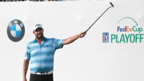 Marc Leishman celebrates after winning the BMW Championship Sunday, vaulting him up the FedEx Cup points standings just in time for the season-ending Tour Championship at East Lake. (AP Photo/Charles Rex Arbogast)