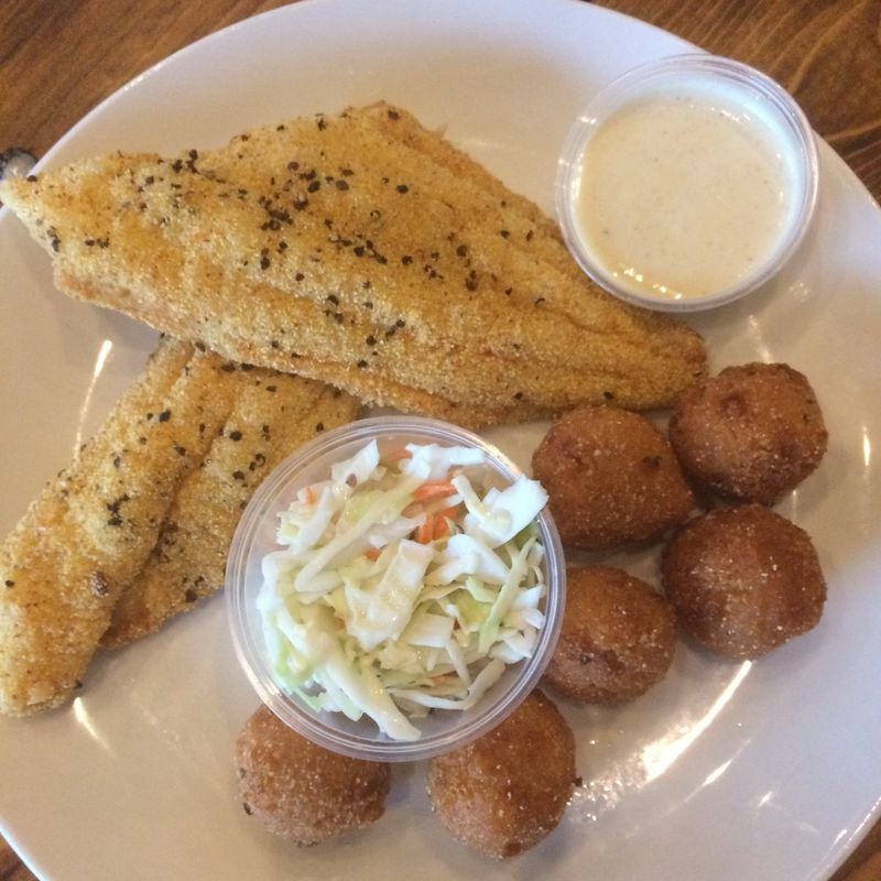 Catfish Hox’s namesake fish is lightly breaded and gently fried; it comes with hush puppies, slaw and house-made remoulade sauce and makes for a solid and satisfying meal. CONTRIBUTED BY WENDELL BROCK