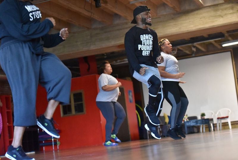 Dwight Holt, celebrity dance fitness instructor, teaches his class at Rhythma Studios recently. HYOSUB SHIN / HSHIN@AJC.COM