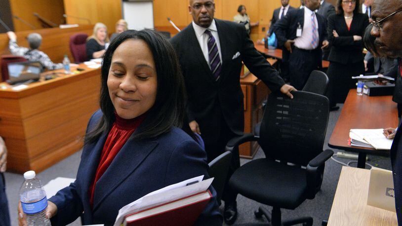 APRIL 14, 2015 ATLANTA Fulton County Chief Senior Asst DA Fani Willis smiles as she walks out of the courtroom following sentencing. Sentencing was completed for 10 of the 11 defendants convicted of racketeering and other charges in the Atlanta Public Schools test-cheating trial before Judge Jerry Baxter in Fulton County Superior Court, Tuesday, April 14, 2015. (Atlanta Journal-Constitution, Kent D. Johnson, Pool) After working with attorneys and prosecutors on the case for nearly two years, both sides became comfortable with me pointing cameras at them. My goal was to cover the trial fairly, the highs as well as the lows. Catching one of the prosecutors with a satisfied smile for a job done well was one of those. Taken on Tue, April 14, 2015 with NIKON D4, on Manual, 1/250 sec, 24.0-70.0 mm f/2.8 lens at 32mm, f/5.6, 12800 ISO