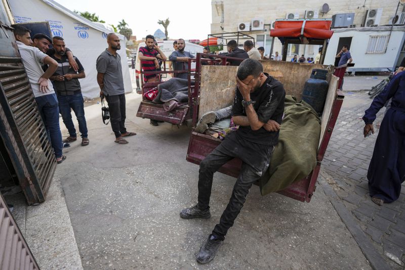 Palestinians mourn their relatives killed in the Israeli bombardment of the Gaza Strip at the Al Aqsa hospital in Deir al Balah, Thursday, April 25, 2024. (AP Photo/Abdel Kareem Hana)