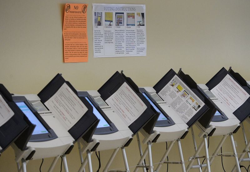 Empty voting machines line the wall inside the Fulton County Government Center in Atlanta on Tuesday, October 22, 2013. JOHNNY CRAWFORD / JCRAWFORD@AJC.COM
