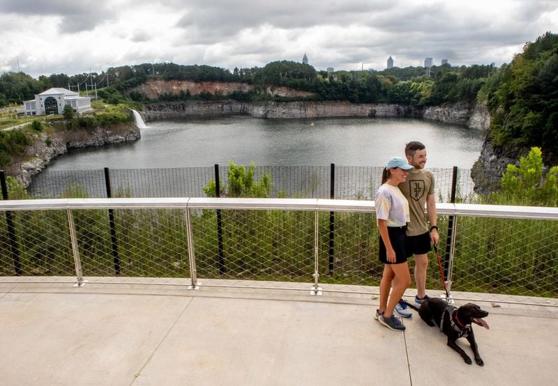 Caroline Schaefer and Thomas Lebens pose for a photograph at the scenic overview after the public opening of Atlanta's largest planned greenspace, the Westside Park, Friday, August 20, 2021.STEVE SCHAEFER FOR THE ATLANTA JOURNAL-CONSTITUTION