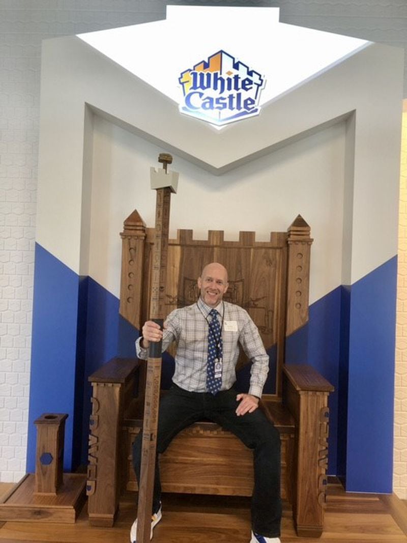 Ken Oberle sits on a throne at White Castle headquarters in Columbus, Ohio. Courtesy of Ken Oberle