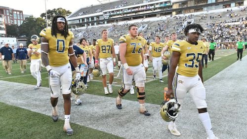 Georgia Tech players leave the football field after Ole Miss defeat Georgia Tech in an NCAA college football game at Georgia Tech's Bobby Dodd Stadium in Atlanta on Saturday, September 17, 2022. Ole Miss won 42-0 over Georgia Tech. (Hyosub Shin / Hyosub.Shin@ajc.com)