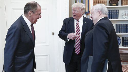 From left, Russia's Foreign Minister Sergei Lavrov, U.S. President Donald Trump, and Russian Ambassador to the United States Sergei Kislyak talk during a meeting at the White House on May 10, 2017.