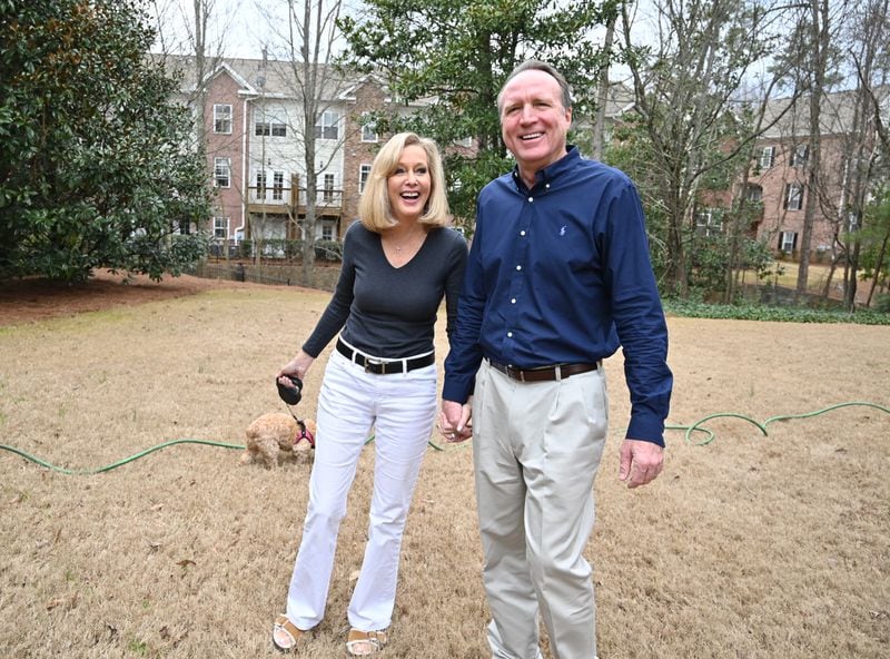February 4, 2020 Atlanta - Kimberley Kennedy and her husband Kent Elsbree react as they walk their dog Gracie on Tuesday, February 4, 2020. Kimberley Kennedy, a WSB-TV reporter and host, made national news two decades ago when her fiancé Lew Dickey (who ran Atlanta-based Cumulus Media) stood her up the day before the wedding. She parlayed this humiliation into a book "Left at the Altar" and remained single for many years. A few years ago, she finally met the man of her dreams and she decided to write a book to inspire other women in their 50s who are single that it's not too late to find "your person." (Hyosub Shin / Hyosub.Shin@ajc.com)