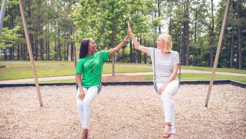 Jody Stephenson (right), founder of SitterTree, gives sitter Khadijah Grier a high-five. Grier was recently ranked a Top 10 Sitter. CONTRIBUTED BY ROSETREE PHOTOGRAPHY