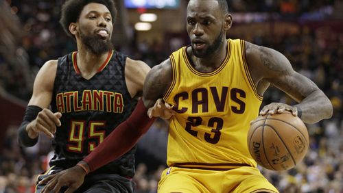 Cleveland Cavaliers' LeBron James (23) drives around Atlanta Hawks' DeAndre Bembry (95) in the second half of an NBA basketball game, Friday, April 7, 2017, in Cleveland. (AP Photo/Tony Dejak)