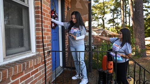 October 19, 2022 Forest Park - Bryna Jimenez (left) and Vanessa Jasso, both with GALEO, canvass for Latino voters in Forest Park on Tuesday, August 19, 2022. GALEO's mission is to increase civic engagement and leadership of the Latino/Hispanic community across Georgia. (Hyosub Shin / Hyosub.Shin@ajc.com)
