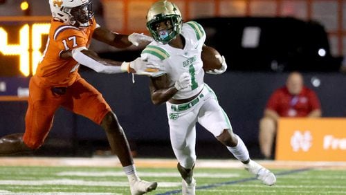 August 20, 2021 - Kennesaw, Ga: Buford wide receiver Isaiah Bond (1) runs after a catch against North Cobb linebacker Joshua Josephs (17) during the first half at North Cobb high school Friday, August 20, 2021 in Kennesaw, Ga.. JASON GETZ FOR THE ATLANTA JOURNAL-CONSTITUTION



