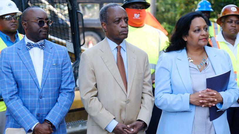 (L-R) DeKalb County Commissioner Larry Johnson, DeKalb CEO Michael Thurmond and Radhika Fox, assistant administrator for the U.S. Environmental Protection Agency’s Office of Water, attend a press conference in Decatur announcing a $284 million water infrastructure finance and innovation act loan to DeKalb County on Thursday, May 19, 2022. (Arvin Temkar / arvin.temkar@ajc.com)