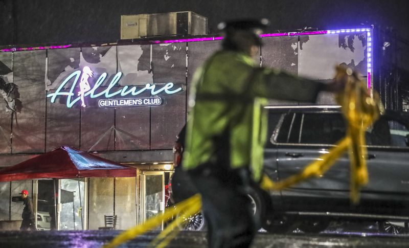 Police respond to emergency calls at strip clubs but are barred from working at the clubs or in their parking lot off-duty. (John Spink / John.Spink@ajc.com)