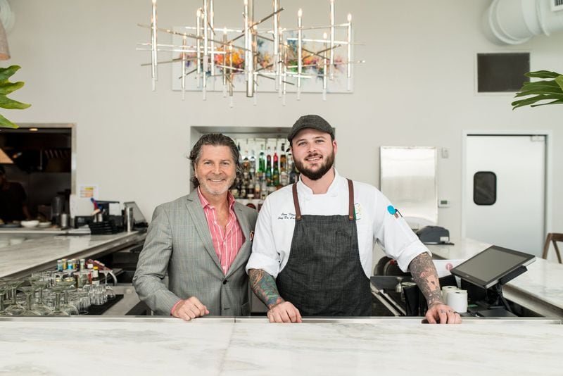 Owner Scott Wilkins (left), and Chef de Cuisine Cam Floyd (right) at the bar at Estrella. Photo credit- Mia Yakel.