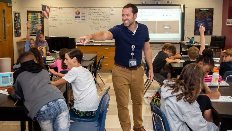 Spence Ford, a science teacher at Samuel M. Inman Middle School in Atlanta, says he is intentional about bringing lessons about climate change to the sixth graders in his earth science classes, but he doesn’t always know how or when he is going to include those lessons. STEVE SCHAEFER / SPECIAL TO THE AJC