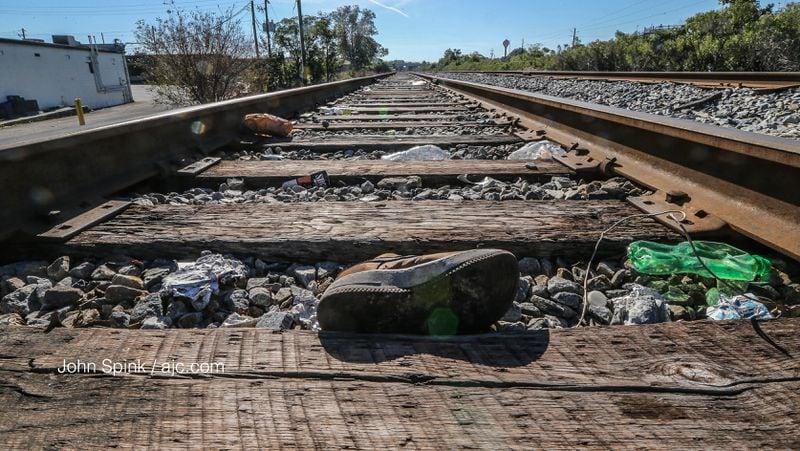 Police said a mother and her 1-year-old son were seriously injured when they tried to crawl under a train on these tracks in Clayton County.