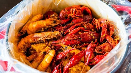 The #1 Boiled Seafood Combo at Kajun Crab includes shrimp, crawfish and corn on the cob. CONTRIBUTED BY HENRI HOLLIS